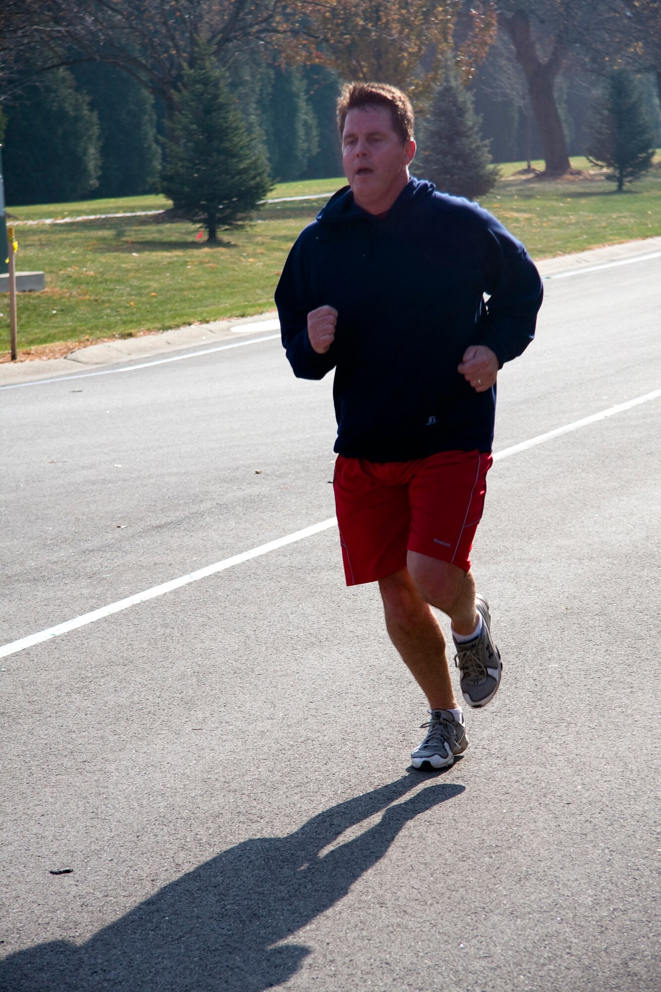 GRISSOM AIR RESERVE BASE, Ind. -- Rich Percival approaches the finish line of a 5-kilometer "Turkey Trot" run held at the fitness center here Nov. 17. Participants guessed how long it would take them to finish the race prior to starting the run. The top three runners whose guesses were closest to their actual run time received a turkey. Percival came in with a time of 25 minutes, 47 seconds, which was only 1 minute, 13 seconds off his predicted run time. Raymond McNitt and Juan Hernandez also guessed close enough to earn themselves a turkey. (U. S. Air Force photo/Tech. Sgt. Mark R. W. Orders-Woempner)
