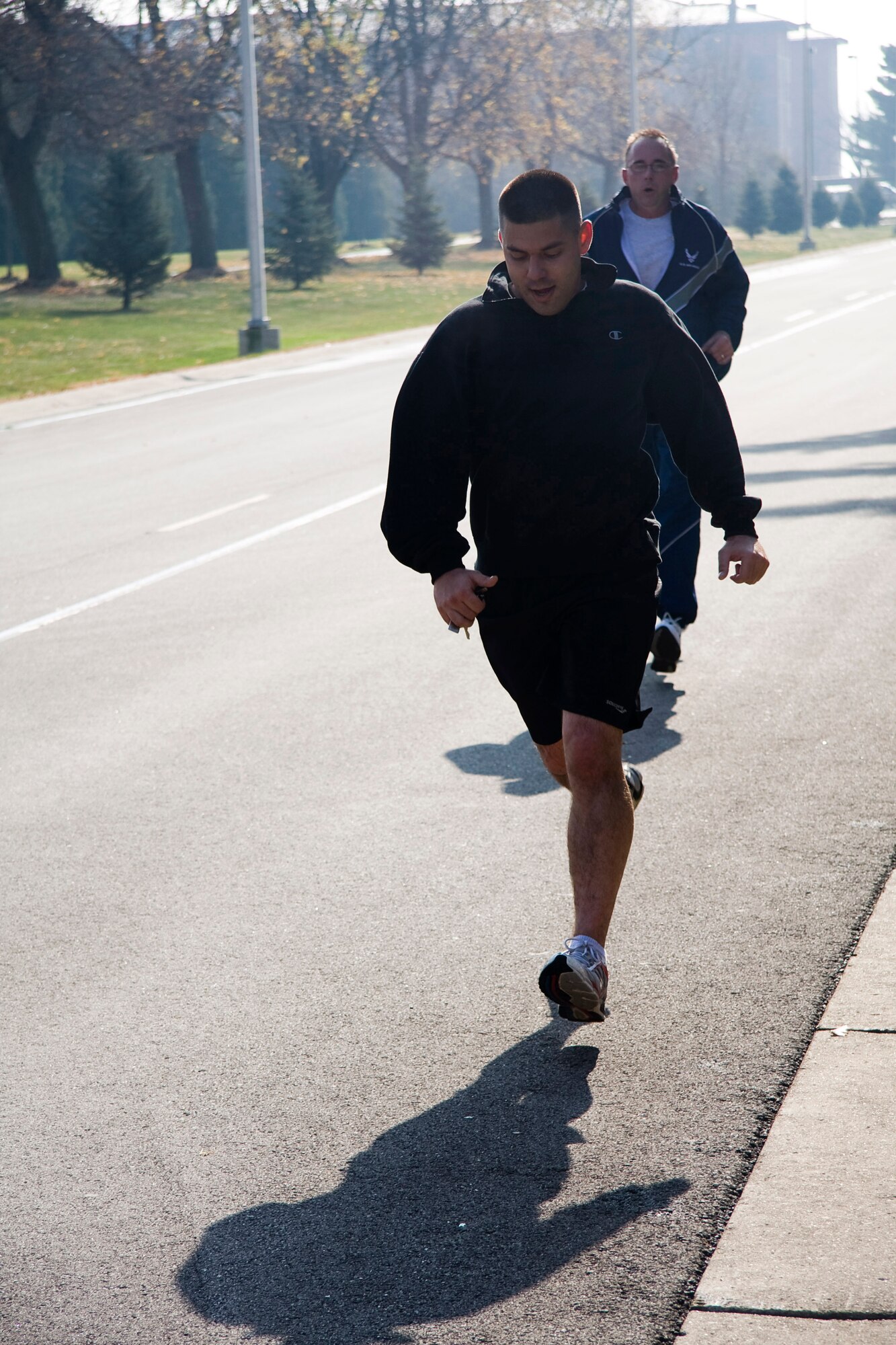 GRISSOM AIR RESERVE BASE, Ind. -- Raymond McNitt nears the finish line of a 5-kilometer "Turkey Trot" run held at the fitness center here Nov. 17. Participants guessed how long it would take them to finish the race prior to starting the run. The top three runners whose guesses were closest to their actual run time received a turkey. McNitt finished the race with a time of 25 minutes, 56 seconds, which was only 4 seconds off his predicted run time. Rich Percival and Juan Hernandez also guessed close enough to earn themselves a turkey. (U. S. Air Force photo/Tech. Sgt. Mark R. W. Orders-Woempner)