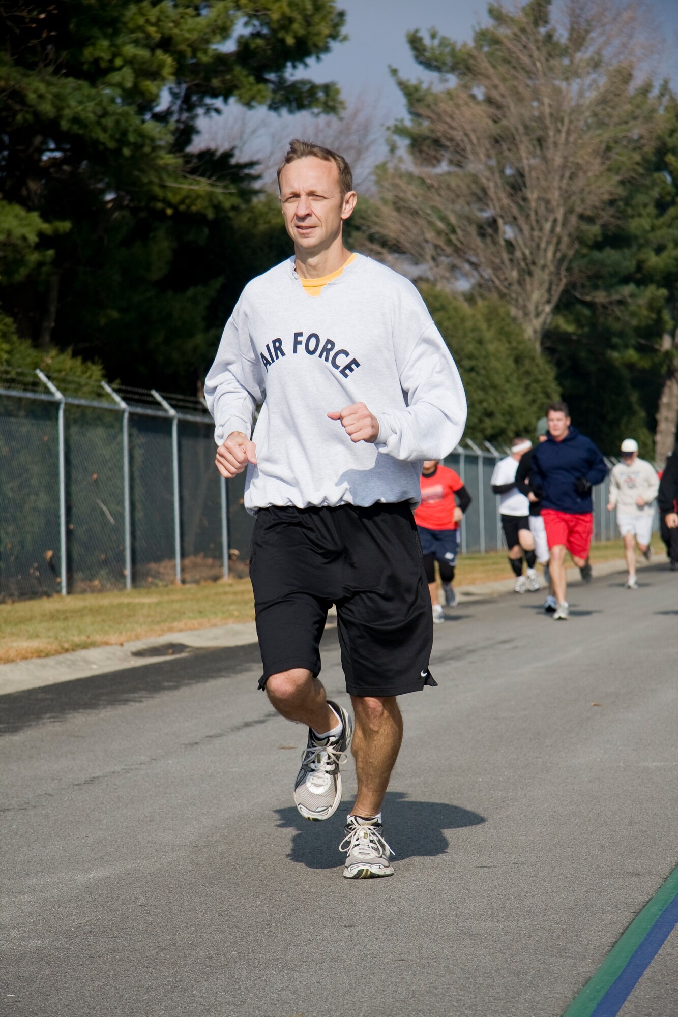 GRISSOM AIR RESERVE BASE, Ind. -- Chris Feltis races down the road during the start of a "Turkey Trot" 5-kilometer run held here Nov. 17. Participants guessed how long it would take them to finish the race prior to starting. The top three runners whose guesses were closest to their actual run time received a turkey. While Feltis finished the race the fastest with a time of 21 minutes, 58 seconds it was Raymond McNitt, Rich Percival and Juan Hernandez who came in closest to their predicted times. Participants included Air Force Reserve, Marine Corps Reserve, civilian and contractor personnel. (U. S. Air Force photo/Tech. Sgt. Mark R. W. Orders-Woempner)
