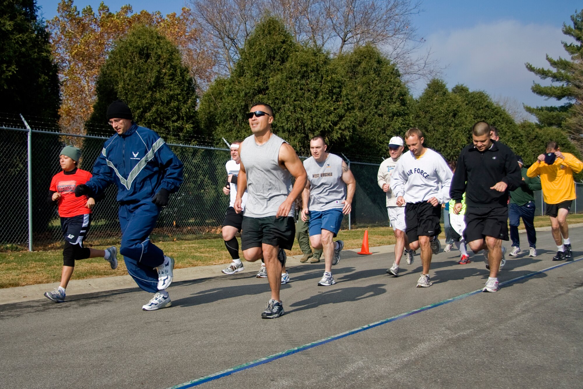 GRISSOM AIR RESERVE BASE, Ind. -- Air Force Reserve, Marine Corps Reserve, civilian and contractor personnel take off from the starting line at a 5-kilometer "Turkey Trot" run held at the fitness center here Nov. 17. Participants guessed how long it would take them to finish the race prior to starting the run. The top three runners whose guesses were closest to their actual run time received a turkey. While Chris Feltis finished the race the fastest with a time of 21 minutes, 58 seconds it was Raymond McNitt, Rich Percival and Juan Hernandez who came in closest to their predicted times. (U. S. Air Force photo/Tech. Sgt. Mark R. W. Orders-Woempner)