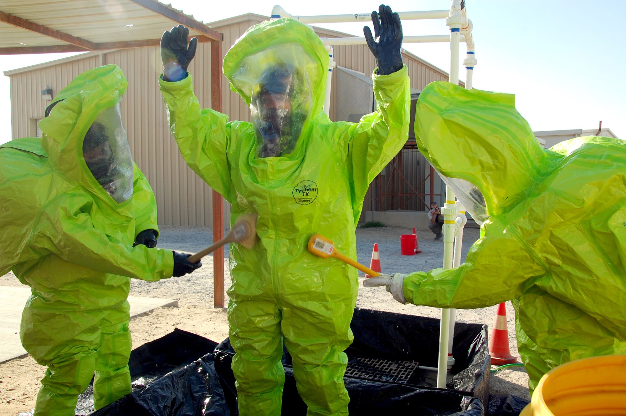 SOUTHWEST ASIA ? Firefighters from the 386th Expeditionary Civil Engineer Squadron practice decontamination procedures at undisclosed air base here Nov. 12. The training scenario was part of a Department of Defense certification program to train firefighters as hazardous-material response technicians. (U.S. Air Force photo by Staff Sgt. Stefanie Torres)