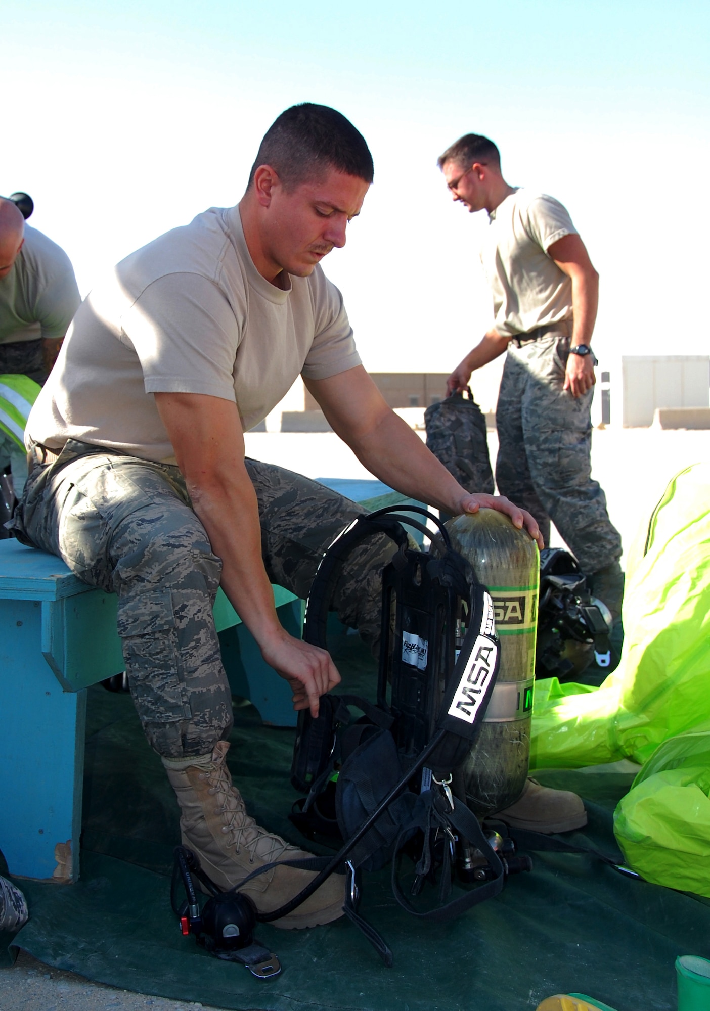 SOUTHWEST ASIA ? Staff Sgt. Donald Broschart , a firefighter from the 386th Expeditionary Civil Engineer Squadron, adjusts his air tank before participating in a traning exercise at an undisclosed air base here Nov. 12. The scenario was part of a Department of Defense certification program to train firefighters as hazardous-material response technicians. Sergeant Broschart is deployed from the 167th West Virginia Air National Guard. (U.S. Air Force photo by Staff Sgt. Stefanie Torres)
