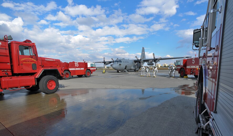 YOKOTA AIR BASE, Japan -- Yokota fire department engages in a C-130 egress scenario here Nov. 18 during the wing's Operational Readiness Exercise. (U.S. Air Force photo/Osakabe Yasuo)