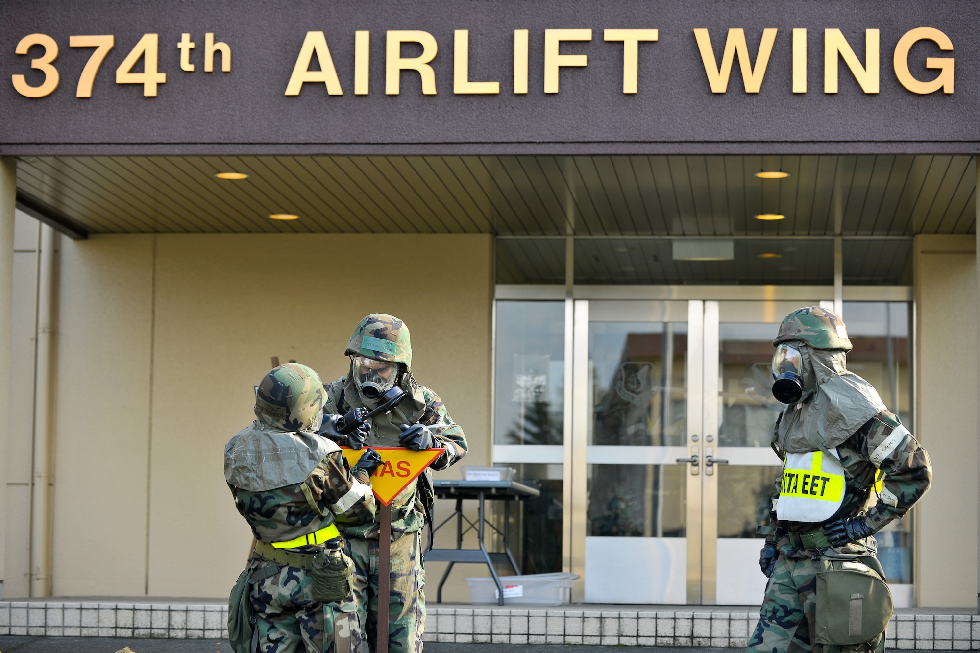 YOKOTA AIR BASE, Japan -- Staff Sgt. Richard Brown (left), 374th Airlift Wing, evaluates 374 AW Post-Attack Reconnaissance Team here, Nov. 18 during the wing's Operational Readiness Exercise. (U.S. Air Force photo/Osakabe Yasuo)