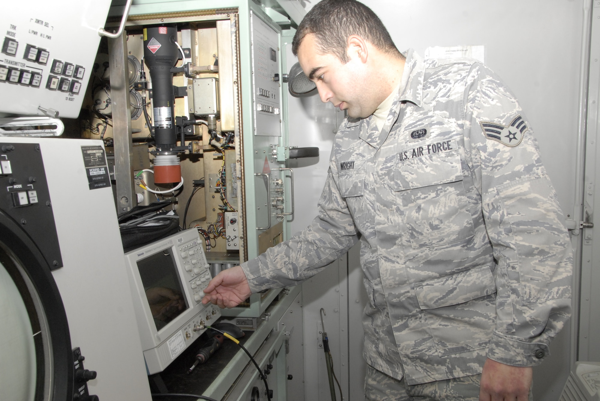 KUNSAN AIR BASE, Republic of Korea -- Senior Airman Benjamin Wright, 8th Communications Squadron radar technician, checks the pulse measurements of the 8th Fighter Wing's precision approach radar Nov. 17. The squadron maintains the PAR, which allows aircraft to "see" the runway and land in inclement weather. (U.S. Air Force photo/Staff Sgt. Amanda Savannah