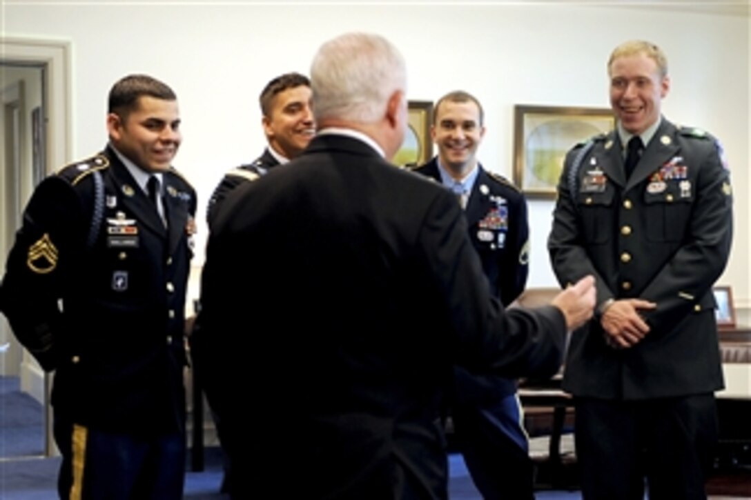 Secretary of Defense Robert M. Gates shares a laugh with Medal of Honor recipient Army Staff Sgt. Salvatore Giunta (2nd from right) and members of the 1st Squad, 1st Platoon, Battle Company, 2nd Battalion (Airborne), 503rd Infantry Regiment, in Gates' office in the Pentagon on Nov. 17, 2010.  Giunta, the first living Medal of Honor recipient since the Vietnam War, received the nation's highest military award for his actions of valor during an enemy attack in the Korengal Valley of Afghanistan in Oct.ober 2007 when he risked his life to save the lives of his fellow soldiers.  