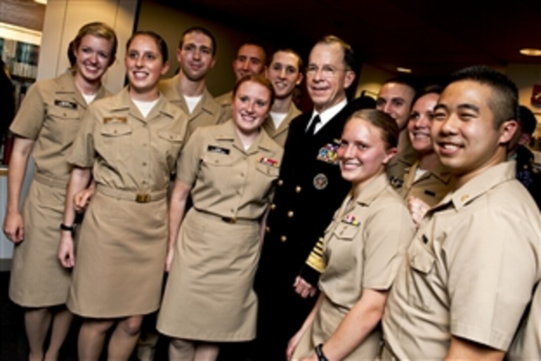 Navy Adm. Mike Mullen, chairman of the Joint Chiefs of Staff, stands with Navy Reserve Officer Training Corps students at Harvard University in Cambridge, Mass., Nov. 17, 2010. Mullen addressed the students at the John F. Kennedy School of Government.