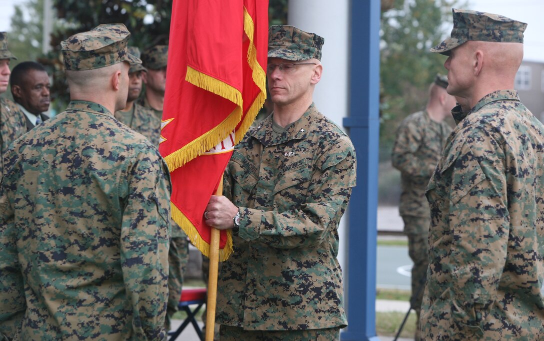 Brig. Gen. Roger R. Machut receives the Mobilization Command’s unit colors from Col. Patrick J McCarthy during Mobilization Command’s change of command ceremony Nov. 18. McCarthy stepped down after a year in command.