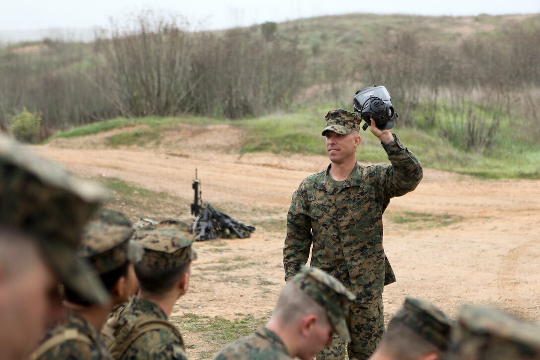Staff Sgt. Eric Schleher, 11th Marine Expeditionary Unit, instructs Marines and sailors on how to properly use the new XM-50 field protective mask on Camp Pendleton, Calif., Nov. 18, 2010.   DoD photo by Gunnery Sgt. William Greeson, U.S. Marine Corps. (Released)::r::::n::