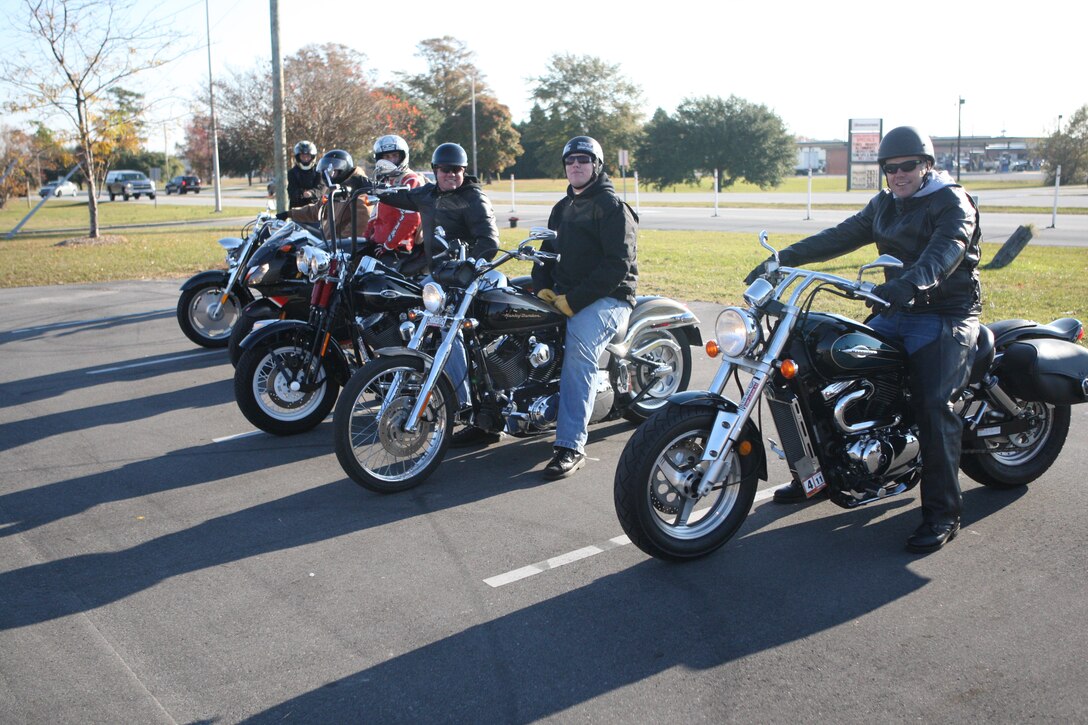 Motorcyclists with 8th Engineer Support Battalion, Combat Logistics Regiment 25, 2nd Marine Logistics Group, prepare to start the 2010 Poker Run, hosted by the Marine Corps Base Camp Lejeune Department of Public Safety, Nov. 19. Participants from Camp Lejeune, Marine Corps Air Stations New River and Cherry Point ride a pre-designated route with multiple checkpoints, collecting a playing card from each and seeing who has the winning hand at the end.