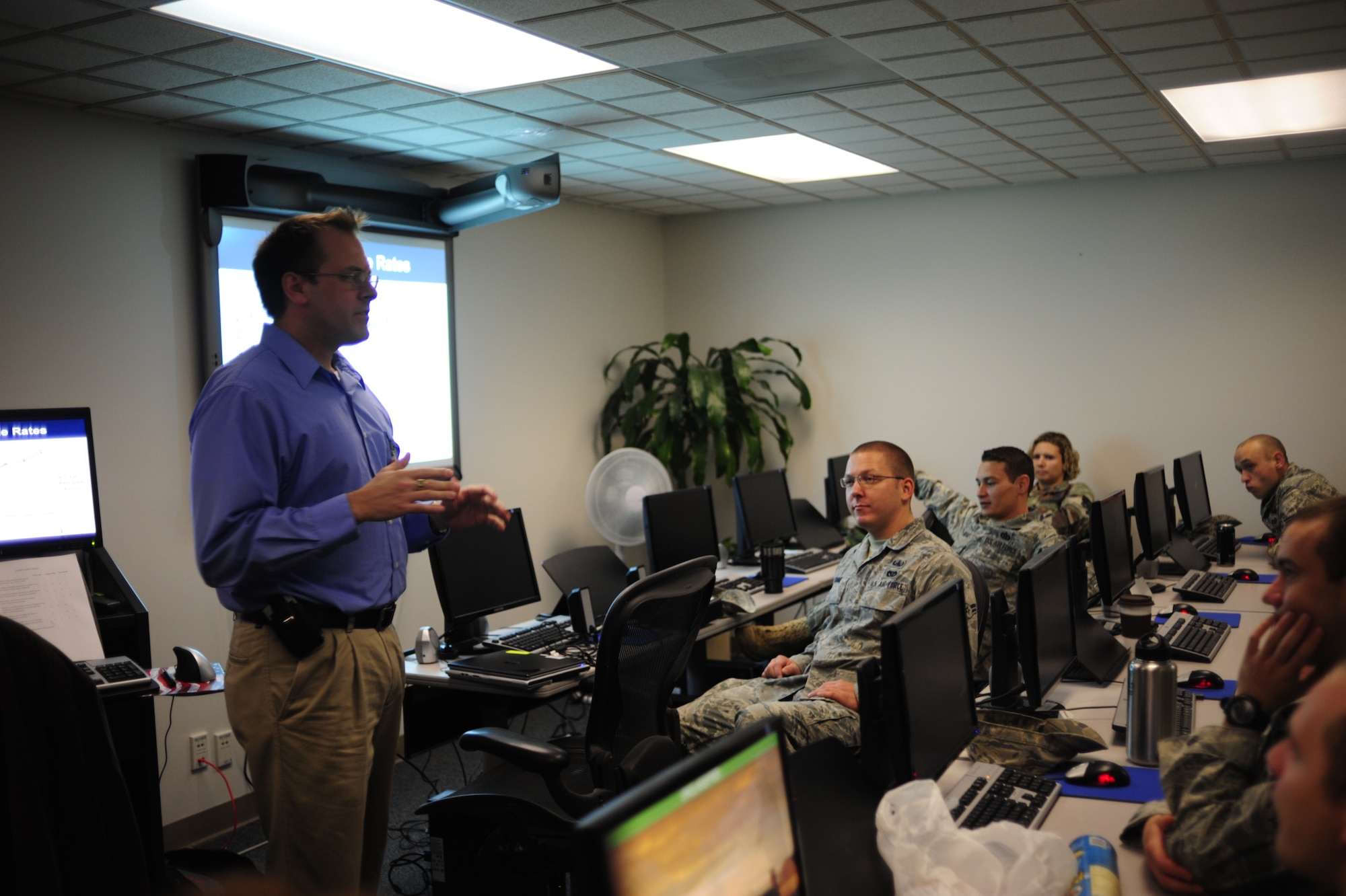 David Luxton, Defense Centers of Excellence National Center for Tele Health and Technology Research Psychologist and Program Manager, gives a briefing on the importance of recognizing the signs of suicide during explosive ordnance disposal safety day Nov. 19 at McChord Field, Joint Base Lewis-McChord, Wash. (U.S. Air Force photo/Airman Leah Young)