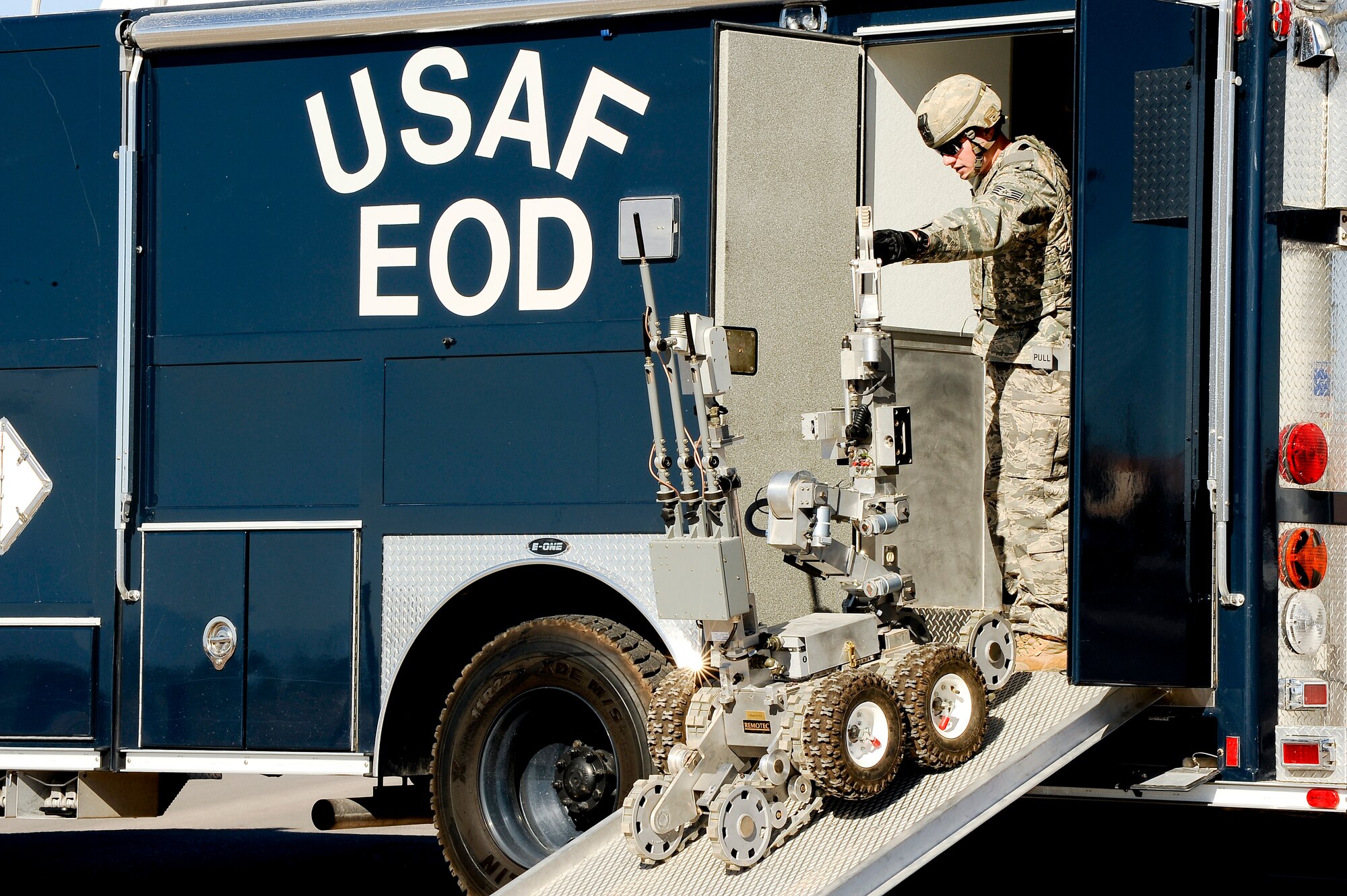 HOLLOMAN AIR FORCE BASE, N.M. -- An Explosive Ordnance Disposal technician guides an ANDROS HD-1 robot out of the EOD truck Nov. 18, 2010. The exercise scenario called for 49th Civil Engineer Squadron EOD Airmen to respond to and neutralize a simulated explosive device. The scenario was part of a base-wide exercise which tested Team Holloman's ability to respond to an emergency situation such as a terrorist attack, and to effectively execute changes to Force Protection Condition in response. The exercise was also held in preparation for the upcoming Operational Readiness Inspection, slated for April 2011. (U.S. Air Force photo by Tech. Sgt. Alan Port/Released)