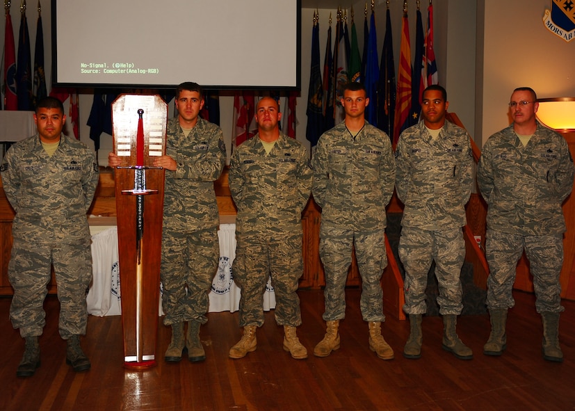DYESS AIR FORCE BASE, Texas—Col. David Been, 7th Bomb Wing commander, presents the Giant Sword Trophy Nov. 19 to maintainers who participated in the 2010 Global Strike Challenge here. Global Strike Challenge is the world’s premier bomber, intercontinental ballistic missile operations and security forces competition with units from Air Force Global Strike Command, Air Combat Command, Air Force Reserve Command and the Air National Guard. Team Dyess earned the Mithcell Trophy for Best Bomb, only 9 feet away from the target; Eaker Trophy for Best B-1 Operations; Best Bomb Munitions Maintenance Team Trophy; Ellis Giant Sword Trophy for Best Bomb Wing Maintenance; and the LeMay Trophy for Best Bomb Squadron, the 7th Operations Support Squadron. (U.S. Air Force photo/Airman 1st Class Brittney Frees)