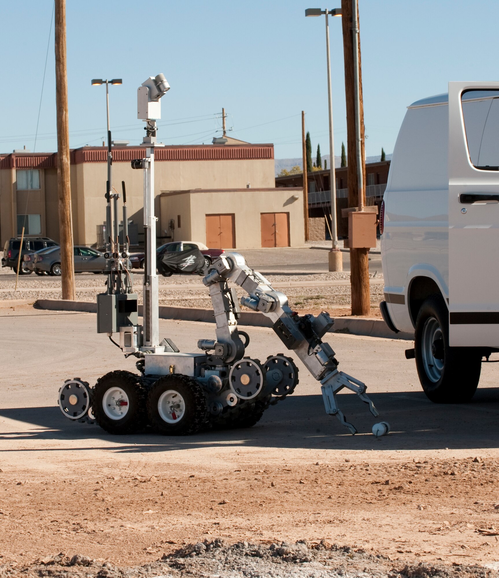 HOLLOMAN AIR FORCE BASE, N.M. -- An ANDROS HD-1 robot is remotely controlled by members of the 49th Civil Engineer Squadron Explosive Ordinance Disposal Flight to perform reconnaissance on a simulated improvised explosive device Nov. 18, 2010. The scenario was part of a base-wide exercise which tested Team Holloman's ability to respond to an emergency situation such as a terrorist attack, and to effectively execute changes to Force Protection Condition in response. The exercise was also held in preparation for the upcoming Operational Readiness Inspection, slated for April 2011. (U.S. Air Force photo by Senior Airman Sondra Escutia/Released)