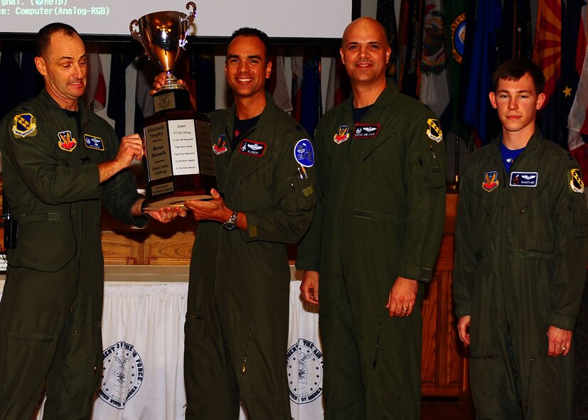 DYESS AIR FORCE BASE, Texas—Col. David Been, 7th Bomb Wing commander, presents the Mitchell Trophy to Lt. Col. Patrick Klinger (left), Lt. Col. Michael Starr (middle), and Capt. Brad Weber (right), Nov. 19 here. Global Strike Challenge is the world’s premier bomber, intercontinental ballistic missile operations and security forces competition with units from Air Force Global Strike Command, Air Combat Command, Air Force Reserve Command and the Air National Guard. Team Dyess earned the Mithcell Trophy for Best Bomb, only 9 feet away from the target; Eaker Trophy for Best B-1 Operations; Best Bomb Munitions Maintenance Team Trophy; Ellis Giant Sword Trophy for Best Bomb Wing Maintenance; and the LeMay Trophy for Best Bomb Squadron, the 7th Operations Support Squadron. (U.S. Air Force photo/Airman 1st Class Brittney Frees)