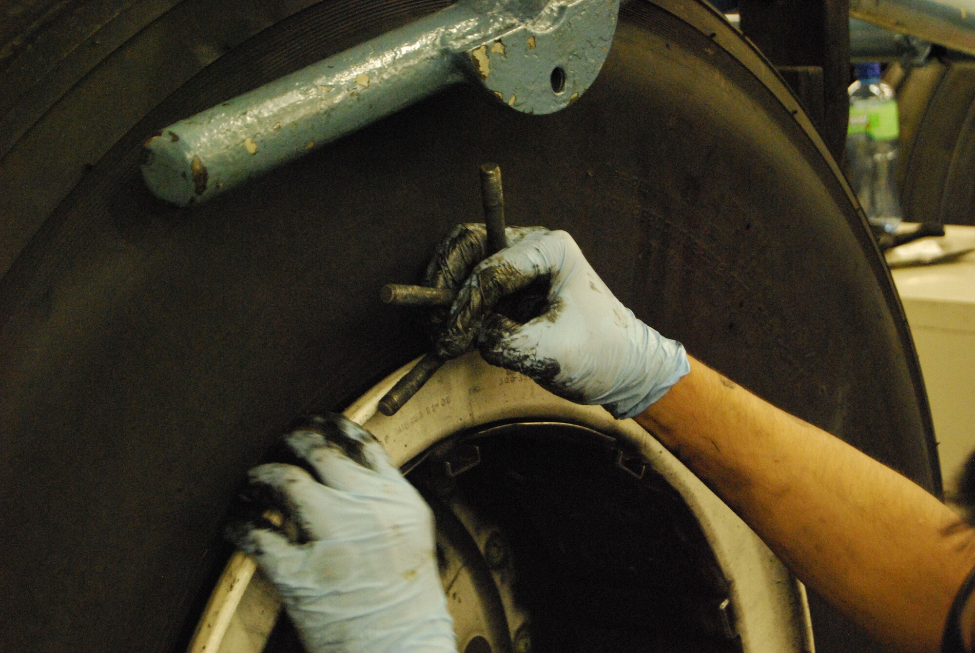 Sometimes the dirtiest jobs are the most vital. The wheel and tire shop Airmen will completely dismantle a C-5A Galaxy main landing gear tire assembly, clean and repack the bearings with fresh grease and then ready a tire for use on the flight line. The job is a dirty but important one. (U.S. Air Force Photo/Master Sgt. Collen McGee)