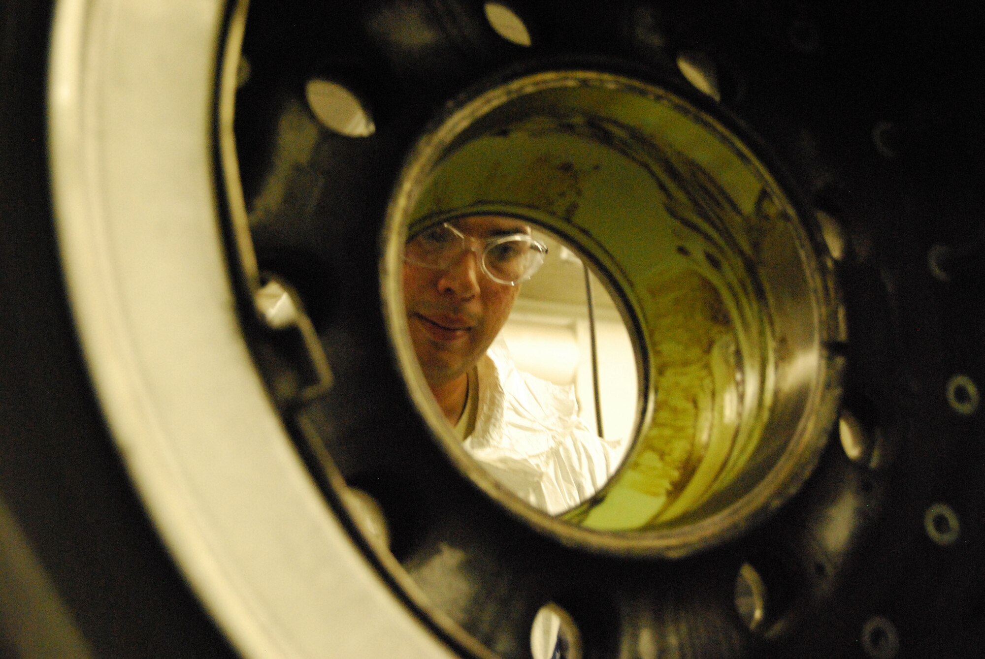 Staff Sgt. Charles Morales Jr. is a maintainer with the 433rd Wheel and Tire Shop. He's  working on the main landing gear wheel and tire assembly from an Alamo Wing C-5 Galaxy. (U.S. Air Force Photo/Master Sgt. Collen McGee) 
