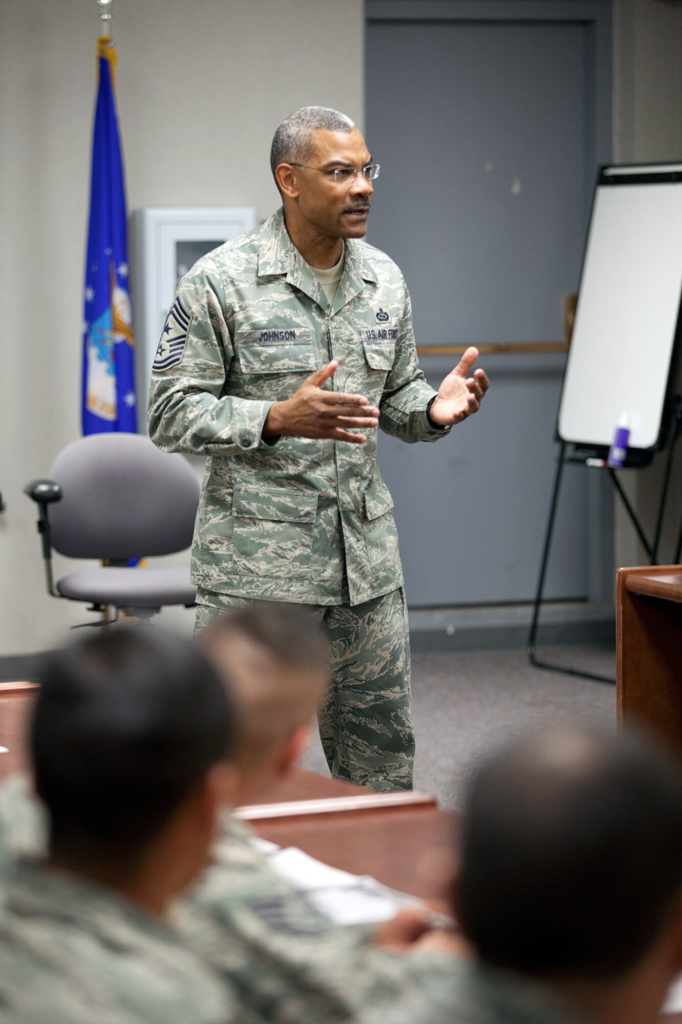 Chief Master Sgt. Jack Johnson, command chief, Air Force Global Strike Command, talks to Warren members during an informed decision briefing as part of his visit here Nov. 7. The chief talked about what options lay ahead for members deciding on their Air Force futures. (U.S. Air Force photo by Jeff Allred)