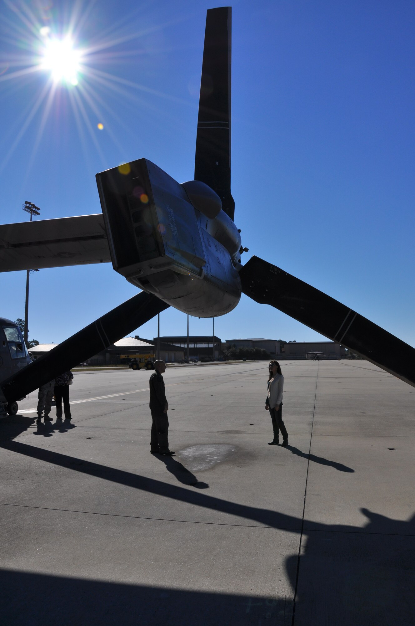 Becky Minger, Miss Ohio 2010, stands underneath a CV-22 propeller while listening to Capt. Robert Marshall, 8th Special Operations Squadron CV-22 pilot, explains the capabilities of the aircraft outside his squadron at Hurlburt Field, Fla., Nov. 17, 2010. Ms. Minger, who will compete for the Miss America crown in January 2011, visited with Hurlburt Airmen before singing the national anthem at the Special Operations Warrior Foundation's Sixth Annual Emerald Coast Salute to Special Operations Forces Dinner later that evening. (U.S. Air Force Photo by Airman 1st Class Joe W. McFadden/Released)