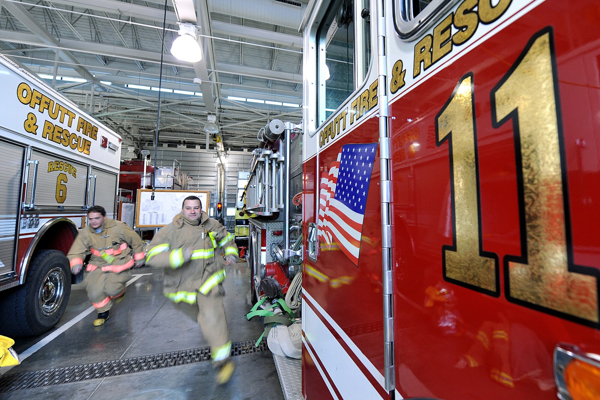 OFFUTT AIR FORCE BASE, Neb. - David Yelovich and Alberto Miranda, fire fighters with the 55th Civil Engineering Squadron, run to a fire truck inside the Offutt Fire Station during their shift Nov. 16. Firefighters here work 24-hour shifts and respond to emergencies both on and off base. They recently sent a team to compete in the World's Firefighter Combat Challenge in South Carolina where they placed 31st out of 200 teams.

U.S. Air Force Photo by Charles Haymond (Released)