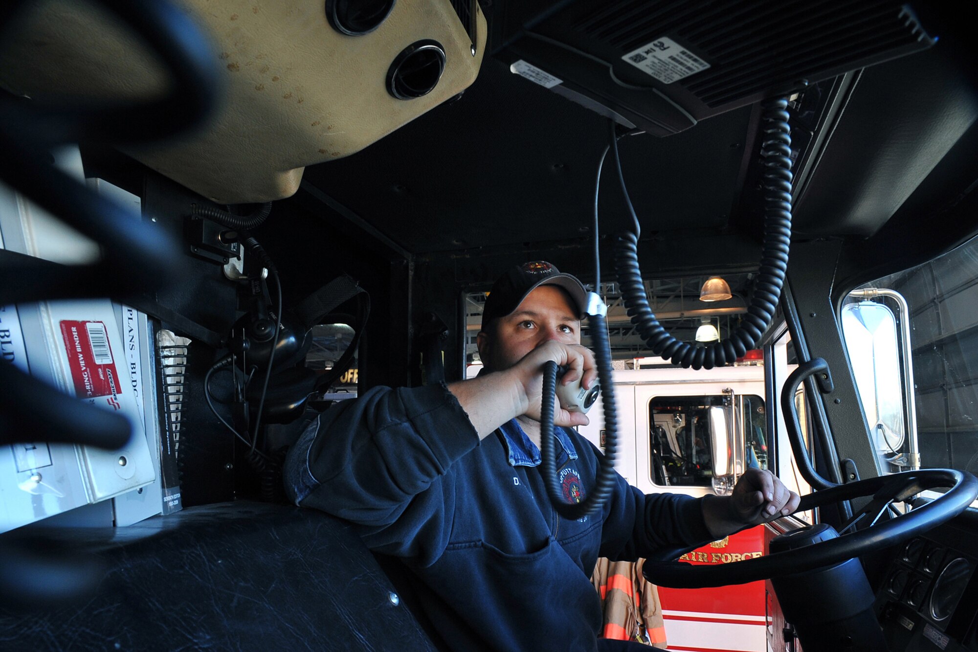 OFFUTT AIR FORCE BASE, Neb. - David Yelovich, fire fighter with the 55th Civil Engineering Squadron, checks his two way radio in his fire truck inside the Offutt Fire Station Nov. 15. Firefighters here work 24-hour shifts and respond to emergencies both on and off base. They recently sent a team to compete in the World's Firefighter Combat Challenge in South Carolina where they placed 31st out of 200 teams.

U.S. Air Force Photo by Charles Haymond (Released)