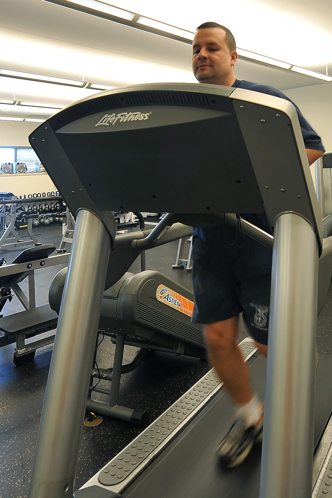 OFFUTT AIR FORCE BASE, Neb. - David Yelovich, fire fighter with the 55th Civil Engineering Squadron, runs on a treadmill inside the Offutt Fire Station Nov. 15. In many respects, the Offutt Fire Station serves as a secondary home for a second "family" since fire fighters work 24-hour shifts; eating, sleeping, working, training, exercising and relaxing in the same location with many of the same people.

U.S. Air Force Photo by Charles Haymond (Released)