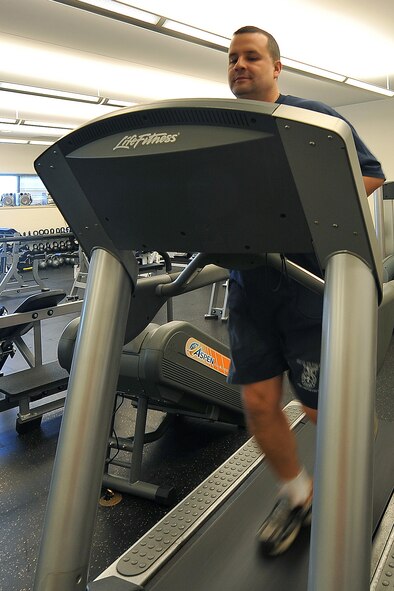 OFFUTT AIR FORCE BASE, Neb. - David Yelovich, fire fighter with the 55th Civil Engineering Squadron, runs on a treadmill inside the Offutt Fire Station Nov. 15. In many respects, the Offutt Fire Station serves as a secondary home for a second "family" since fire fighters work 24-hour shifts; eating, sleeping, working, training, exercising and relaxing in the same location with many of the same people.

U.S. Air Force Photo by Charles Haymond (Released)