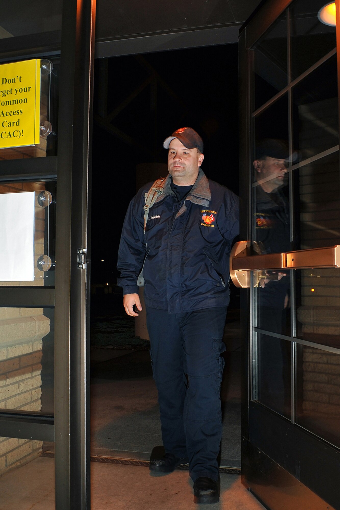 OFFUTT AIR FORCE BASE, Neb. - David Yelovich, fire fighter with the 55th Civil Engineering Squadron, walks inside the Offutt Fire Station during his shift Nov. 16. In many respects, the Offutt Fire Station serves as a secondary home for a second "family" since fire fighters work 24-hour shifts; eating, sleeping, working, training, exercising and relaxing in the same location with many of the same people.

U.S. Air Force Photo by Charles Haymond (Released)