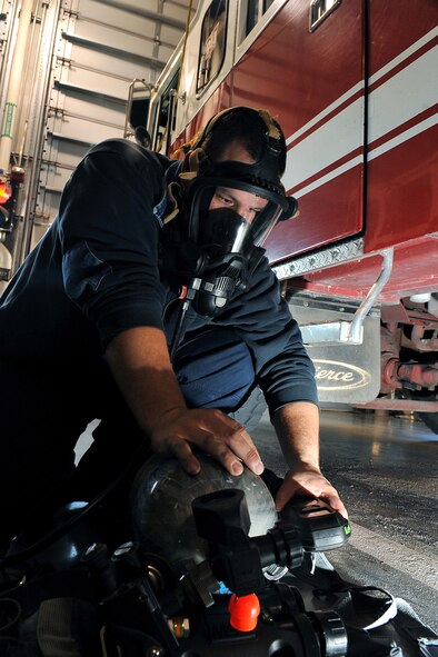 OFFUTT AIR FORCE BASE, Neb. - David Yelovich, fire fighter with the 55th Civil Engineering Squadron, checks an air gage on his oxygen tank inside the Offutt Fire Station Nov. 15. Firefighters here work 24-hour shifts and respond to emergencies both on and off base. They recently sent a team to compete in the World's Firefighter Combat Challenge in South Carolina where they placed 31st out of 200 teams.

U.S. Air Force Photo by Charles Haymond (Released)
