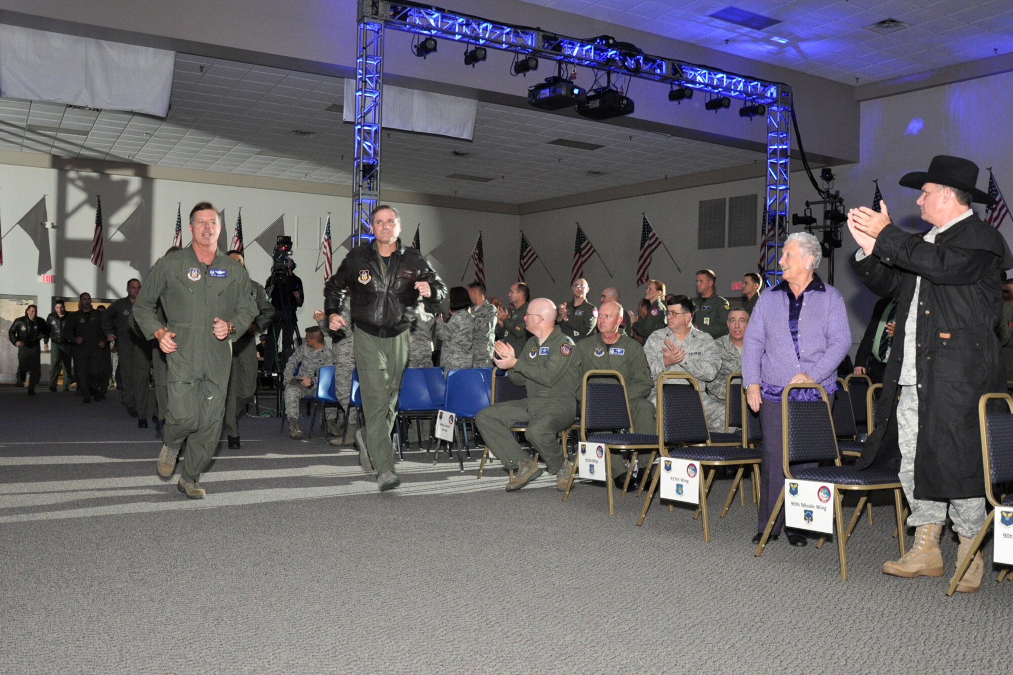Col. Keith Schultz, 917th Operations Group, commander, and Lt. Col. Steven Smith, 343rd Bomb Squadron, director of operations, lead the 917th Wing team into Hoban Hall at Barksdale Air Force Base, La., for the first night of score postings during the first-ever Global Strike Challenge, Nov. 16, 2010. More than 400 Airmen from many bases joined in the competition that began in April. The competition wraps up November 17, with the awarding of trophies to the final winners. (U.S. Air Force photo/Tech. Sgt. Jeff Walston)