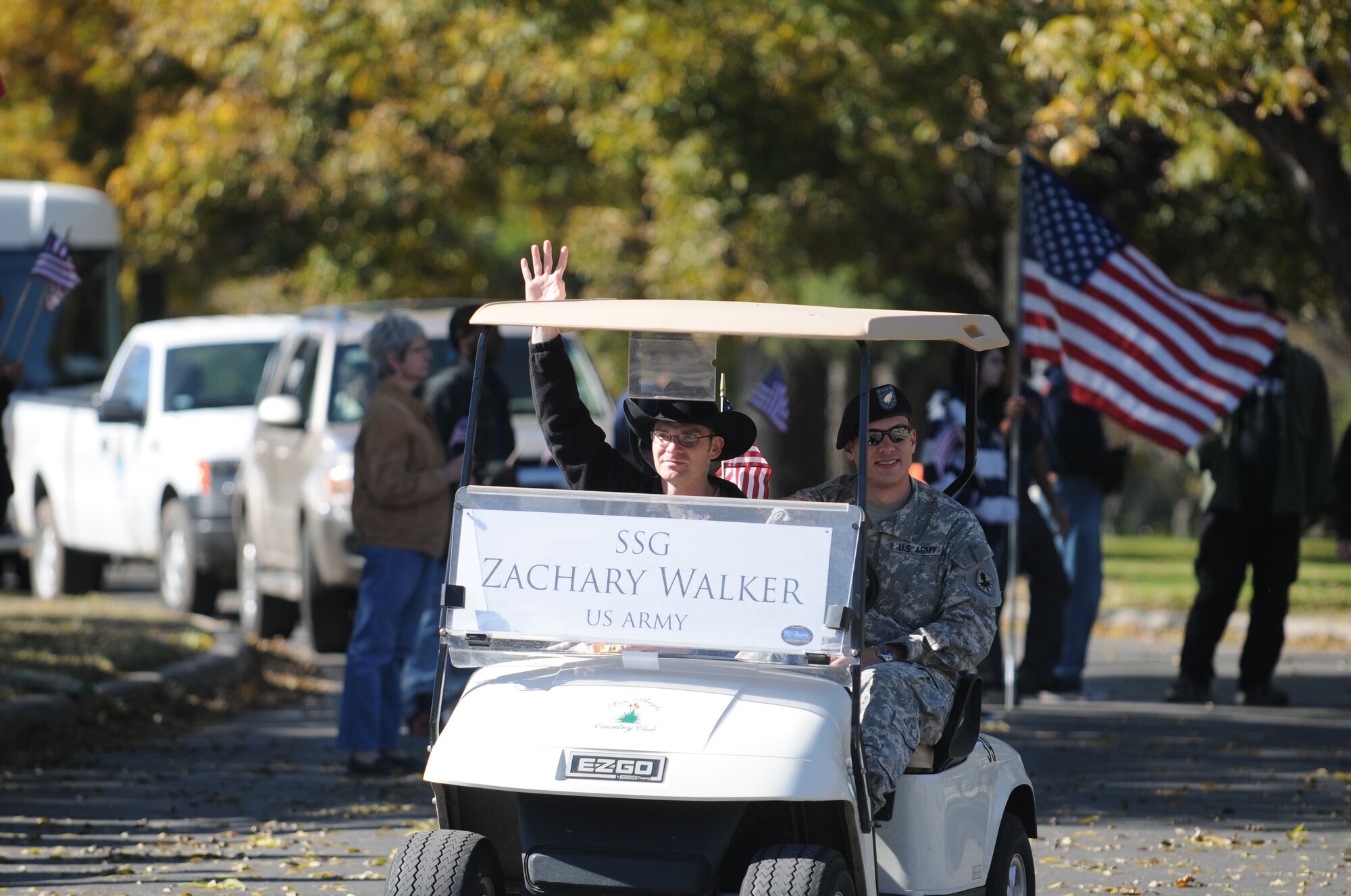 SAN ANGELO, Texas -- Army Staff Sgt. Zachary Walker waves as he rides by during the Hunt for Heroes Parade Nov. 19, 2010. (U.S. Air Force photo/Airman 1st Class Clayton Lenhardt)