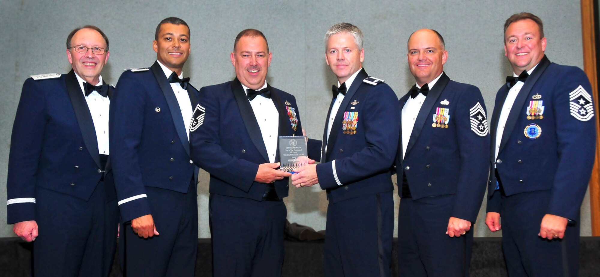(Left to right) Lt. Gen. Charles E. Stenner, Jr,  commander, Air Force Reserve Command, Col. Joe N. Wilburn, commander, AFRC Recruiting Service, Senior MSgt. Michael Seals, a former senior recruiter for McConnell and Tinker AFB, Lt. Col. Barry Jones ,commander, 931st Operations Support Squadron
Chief MSgt Dwight D. Badgett, command chief, AFRCommand and  
Chief MSgt Robert Starkey, command chief, AFRC Recruiting Service pose for a photograph after the presentation of the "Get One" award during the recent recruiting banquet. Colonel Jones accepted the award on behalf of Col. Edsel Frye, commander of the 931st Air Refueling Group. The recruiting service honored the 931st with the award for its support of recruiting efforts.
