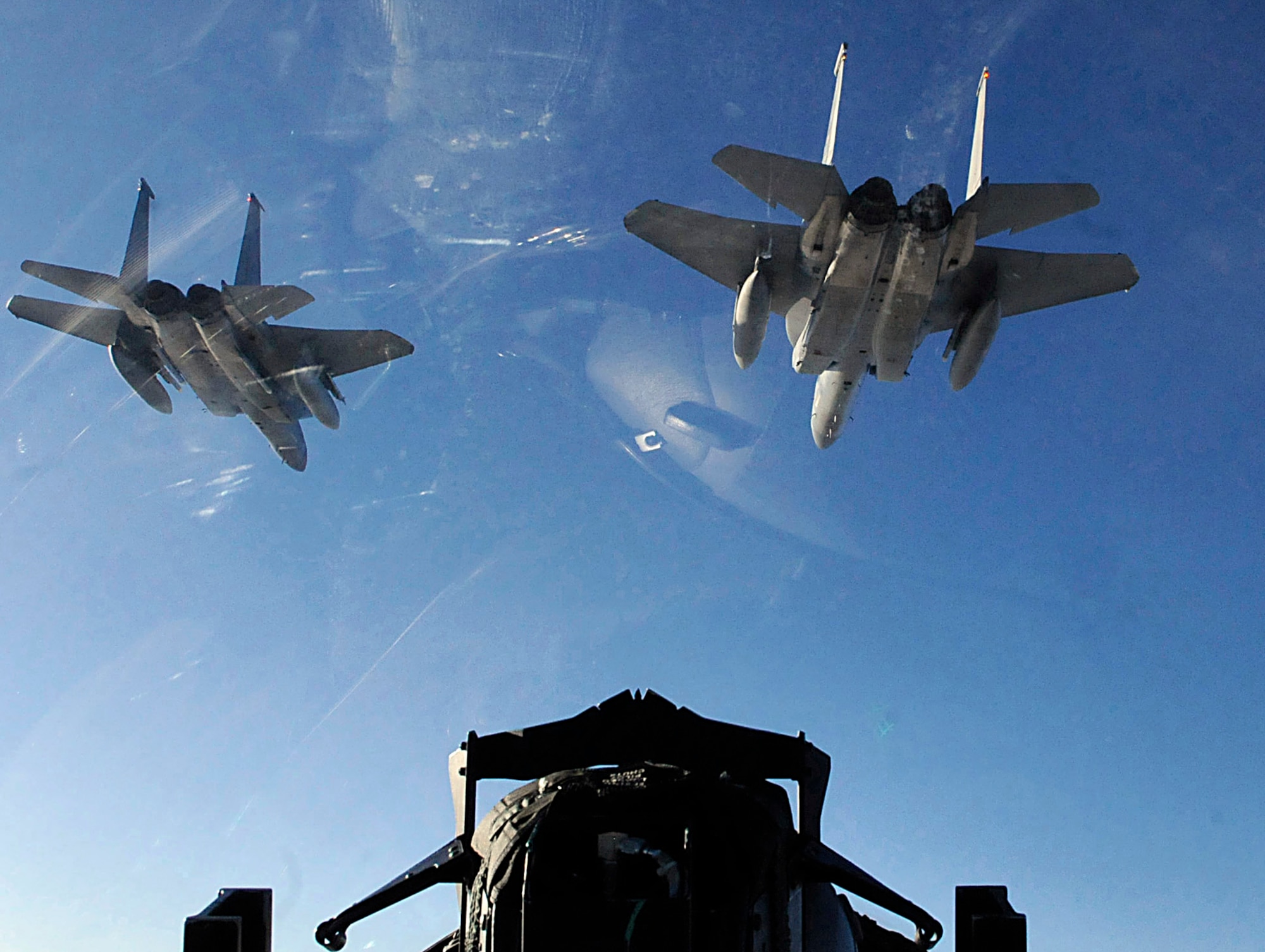 Three F-15 Eagles from the 44th Fighter Squadron train with Japan Air Self Defense Forces Nov. 17, 2010, off the coast of Hokkaido, Japan. Twelve jets and nearly 200 Airmen from Kadena Air Base, Japan, partcipated in an Aviation Training Relocation. (U.S. Air Force photo/Tech. Sgt. Mike Tateishi)