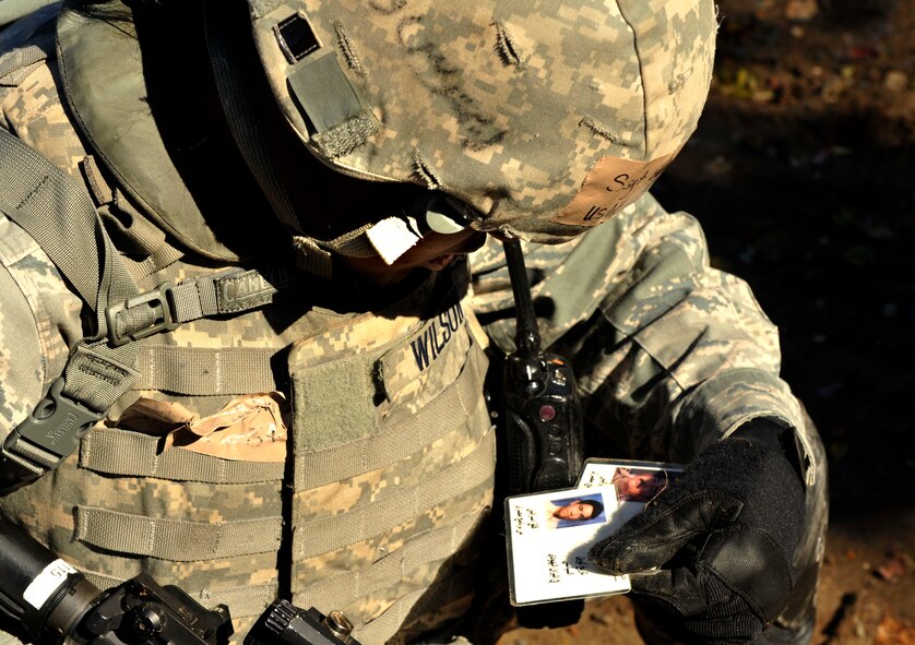 MOODY AIR FORCE BASE, Ga. -- Staff Sgt. Dea Metrice Wilson, 23rd Security Forces Squadron defender reviews some of the information that was pulled from an injured enemy that was captured Nov. 17. The patrol had to restrain, search and clear the subject, which is part of what they will be graded on during the upcoming Phase II Operational Readiness Inspection. (U.S. Air Force photo/Airman 1st Class Nicholas Benroth)(RELEASED)