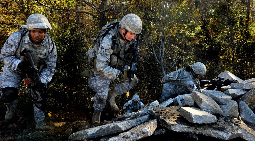 MOODY AIR FORCE BASE, Ga. -- Two of the squads that made up the patrol team moved to either side of a hill in order to flank the opposing forces Nov 17. “This was just one of many strategies that the patrol could have taken in order to neutralize the opposing forces,” said Chief Master Sgt. Joseph Pritchard, 23rd Security Forces Squadron security forces manager. (U.S. Air Force photo/Airman 1st Class Nicholas Benroth)(RELEASED)
