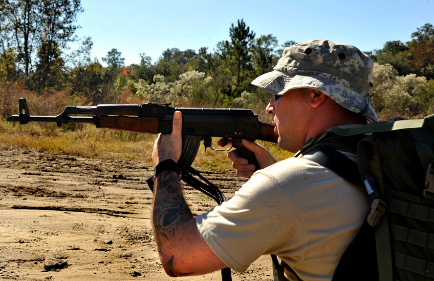MOODY AIR FORCE BASE, Ga. -- Staff Sgt. David Smith, 23rd Security Forces Squadron military working dog handler, fires blank rounds in the direction of the patrol as he retreats from his position Nov. 17. Sergeant Smith along with other members of the squadron played the role of the opposing forces during a recent Phase II Operational Readiness Exercise. (U.S. Air Force photo/Airman 1st Class Nicholas Benroth)(RELEASED)