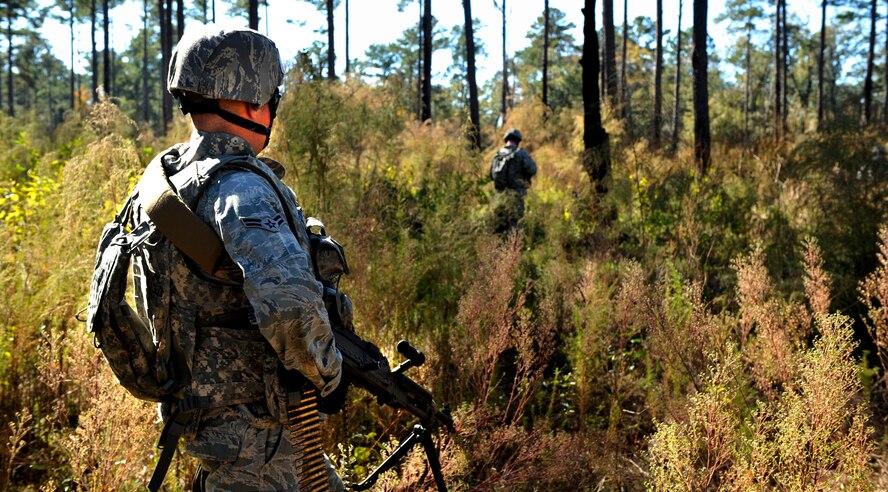 MOODY AIR FORCE BASE, Ga. -- Airman 1st Class Brian Aldred, 23rd Security Forces Squadron defender, scans the woods for opposing forces as the patrol moves through dense vegetation Nov. 17. The patrol forms up depending on the terrain of the environment. (U.S. Air Force photo/Airman 1st Class Nicholas Benroth)(RELEASED)