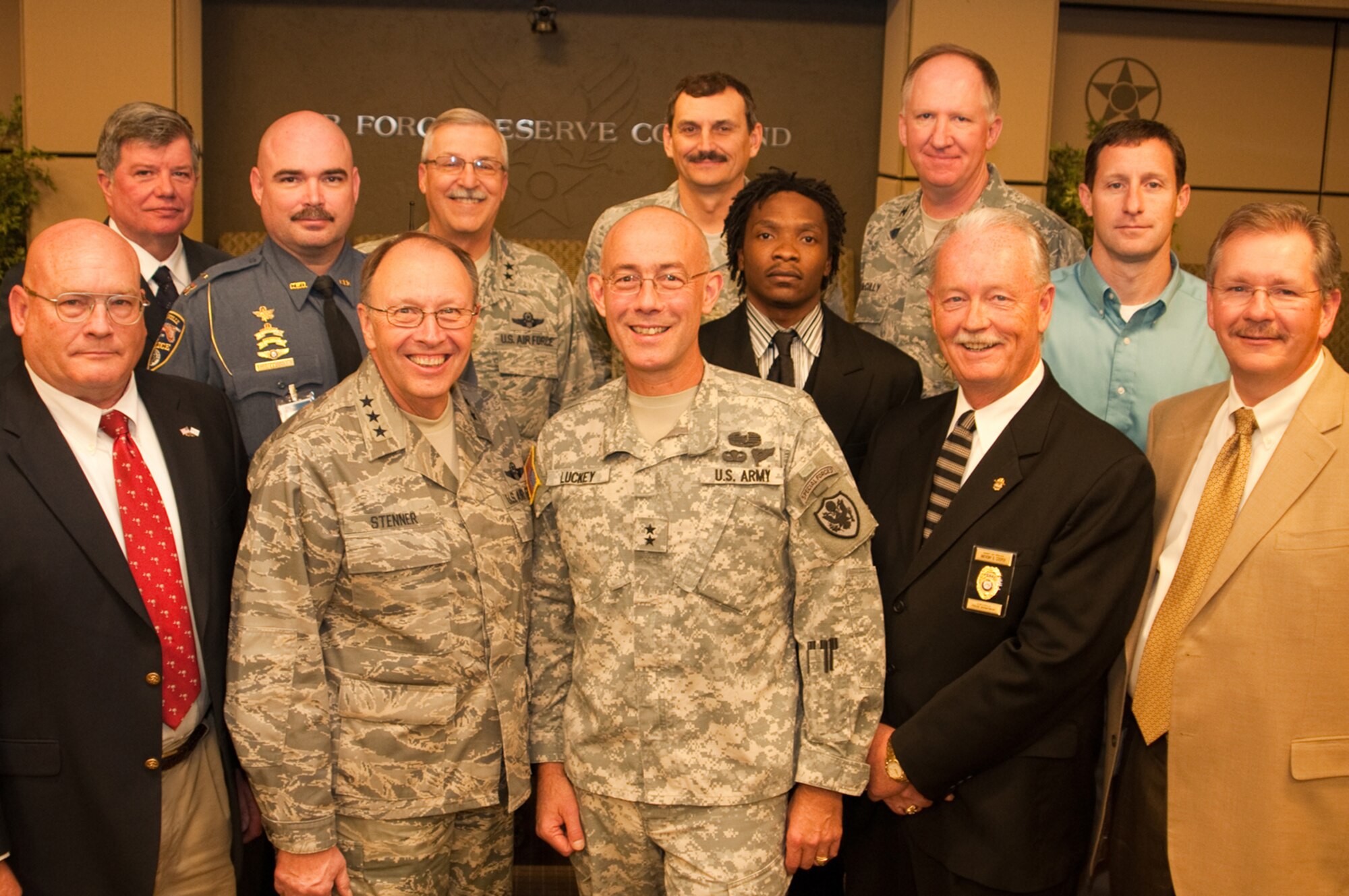 In the foreground, second from left, Lt. Gen. Charles E. Stenner Jr., commander of the Air Force Reserve Command, stands next to Army Maj. Gen. Charles Luckey, assistant chairman to the Joint Chiefs of Staff for Reserve Matters in Washington D.C., as they pose for a photo with Middle Georgia employers Nov. 18, 2010. The generals hosted a luncheon for the employers who received the Employer Support of the Guard and Reserve's Patriot Award. (U.S. Air Force photo/Staff Sgt. Alexy Saltekoff)