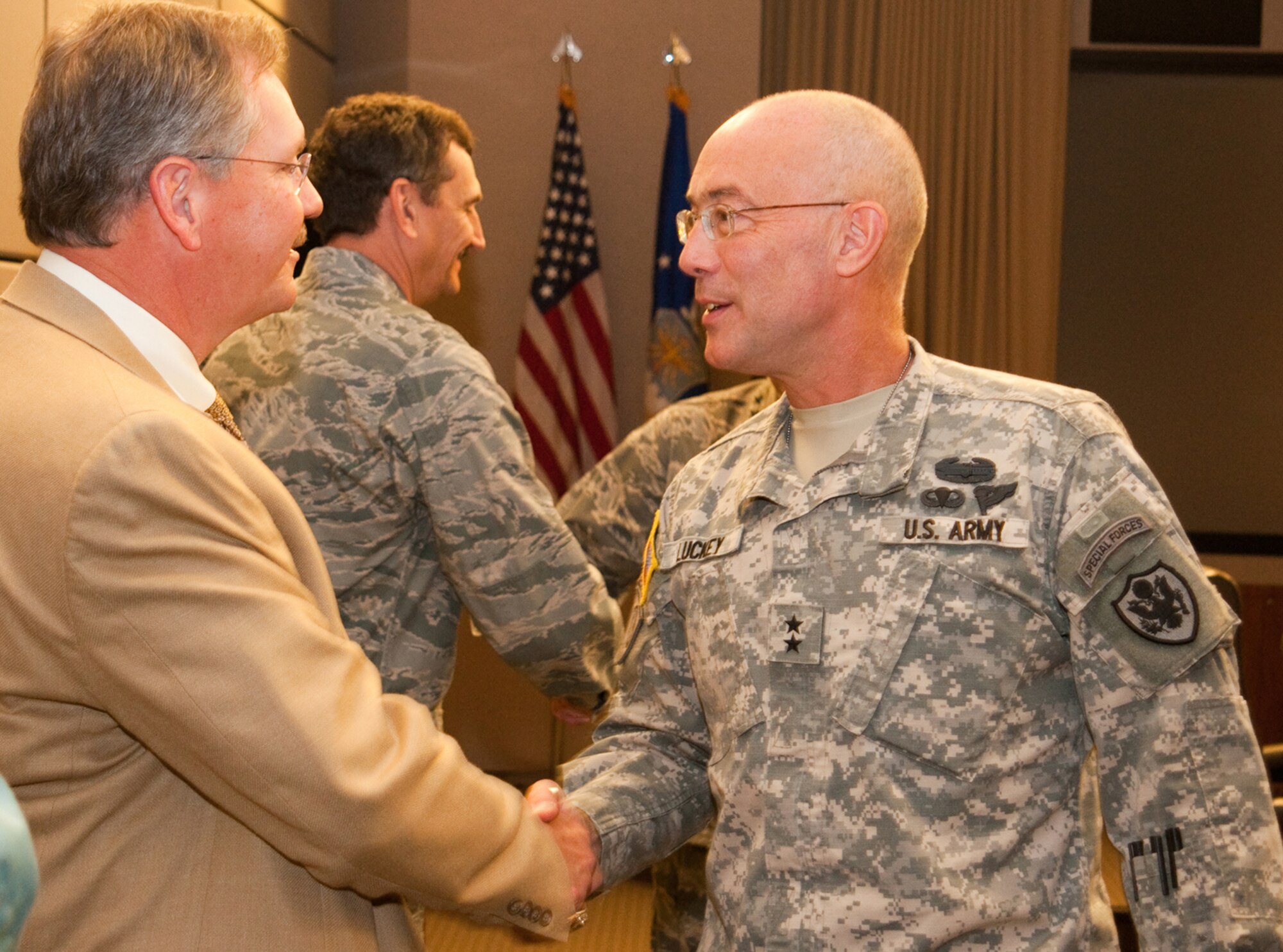 George McCanless, left, president and publisher of the Telegraph in Macon, Ga., shakes hands with Army Maj. Gen. Charles Luckey, assistant chairman to the Joint Chiefs of Staff for Reserve Matters in Washington, D.C., on Nov. 18, 2010. General Luckey co-hosted a luncheon for Mr. McCanless and other Middle Georgia employers at Headquarters Air Force Reserve Command, Robins Air Force Base, Ga. (U.S. Air Force photo/Staff Sgt. Alexy Saltekoff)