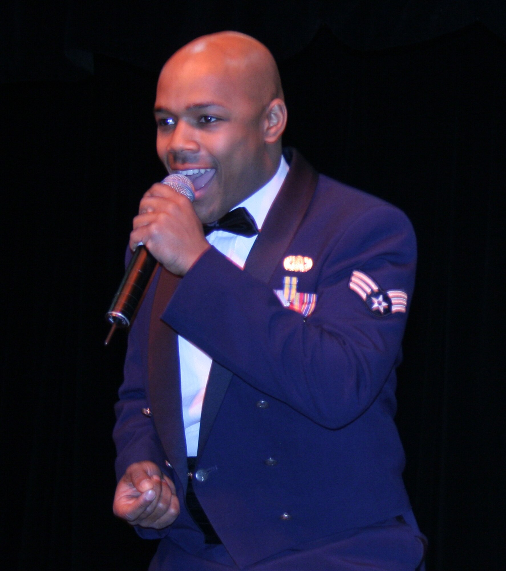 Vocalist Senior Airman Andrew Jones sings at a previous Band of Flight performance.  The Band of Flight will be performing their annual holiday concerts December 11-13 at the Dayton Masonic Center.  Free tickets for the performances will be available starting November 22. (Air Force photo by 2nd Lt. Daniel W. Boothe)
