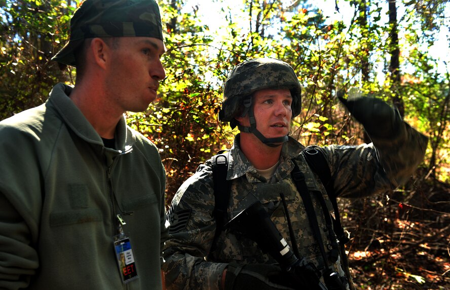 MOODY AIR FORCE BASE, Ga -- Tech. Sgt. Clinton Ellis, 23rd Security Forces Squadron, NCO in charge of training, speaks to Staff Sgt. Joshua Matz, 23rd Security Forces Squadron unit trainer, about his plan of attack for the tasked scenario during a Phase II Operational Readiness Exercise Nov. 17. The main goal of an ORE is to test the capabilities of Moody members in their assigned career fields while deployed. (U.S. Air Force photo/Airman 1st Class Joshua Green)(RELEASED)
