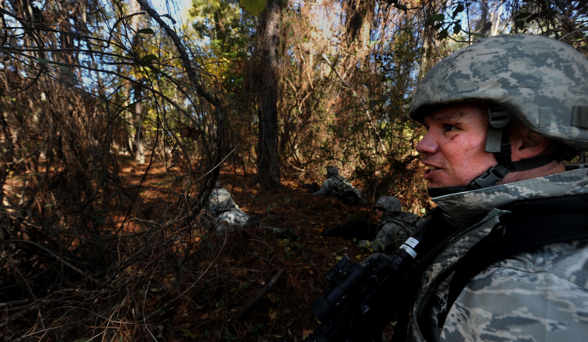 MOODY AIR FORCE BASE, Ga. -- Tech. Sgt. Clinton Ellis, 23rd Security Forces Squadron, NCO in charge of training, shouts to one of his squad leaders to move forward during a Phase II Operational Readiness Exercise Nov. 17. In the altercation between the 23rd SFS and the opposing forces, one team laid down suppressive fire while the other members conducted a sweep maneuver to apprehend the oppositional forces. (U.S. Air Force photo/Airman 1st Class Joshua Green)(RELEASED)
