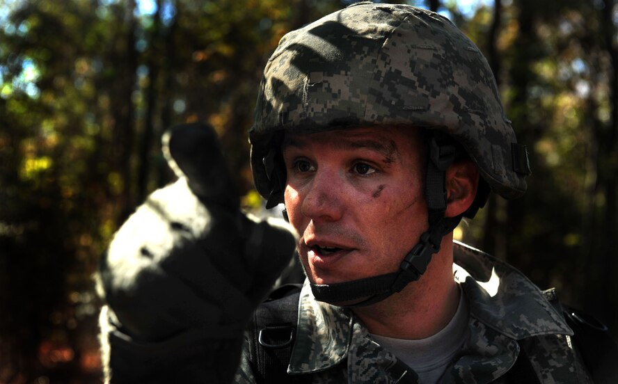 MOODY AIR FORCE BASE, Ga. -- Tech. Sgt. Clinton Ellis, 23rd Security Forces Squadron, NCO in charge of training, gives the signal for his team to move into position and prepare to engage opposing forces during a Phase II Operational Readiness Exercise Nov. 17. As the team moved into position, a suspicious individual was sighted and the team received the order to challenge them. (U.S. Air Force photo/Airman 1st Class Joshua Green)(RELEASED)   
