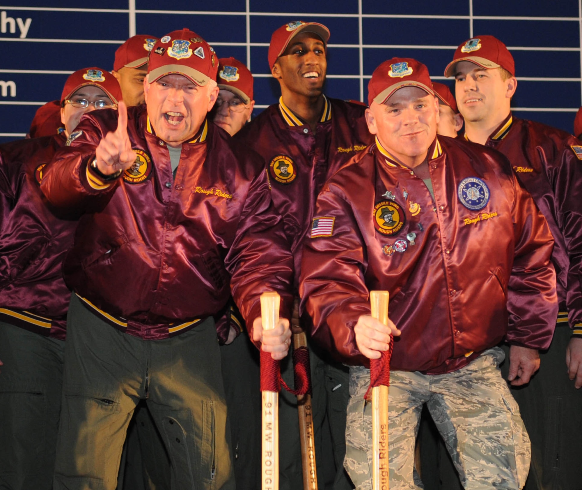 Members from the 91st Missile Wing, Minot Air Force Base, N.D., shout their team chant during the score postings at Barksdale Air Force Base, La., Nov. 16. During score posting events, teams displayed team spirit and mission heritage by donning competitive gear that represents their unit traditions as well as incorporating team mascots into activities. The 91 MW and the 5th Bomb Wing won the Spirit Award for teamwork and esprit de corps, as well as taking home the trophy for best Intercontinental Ballistic Missile force satelite communication. (U.S. Air Force photo/Senior Airman Alexandra M. Boutte)