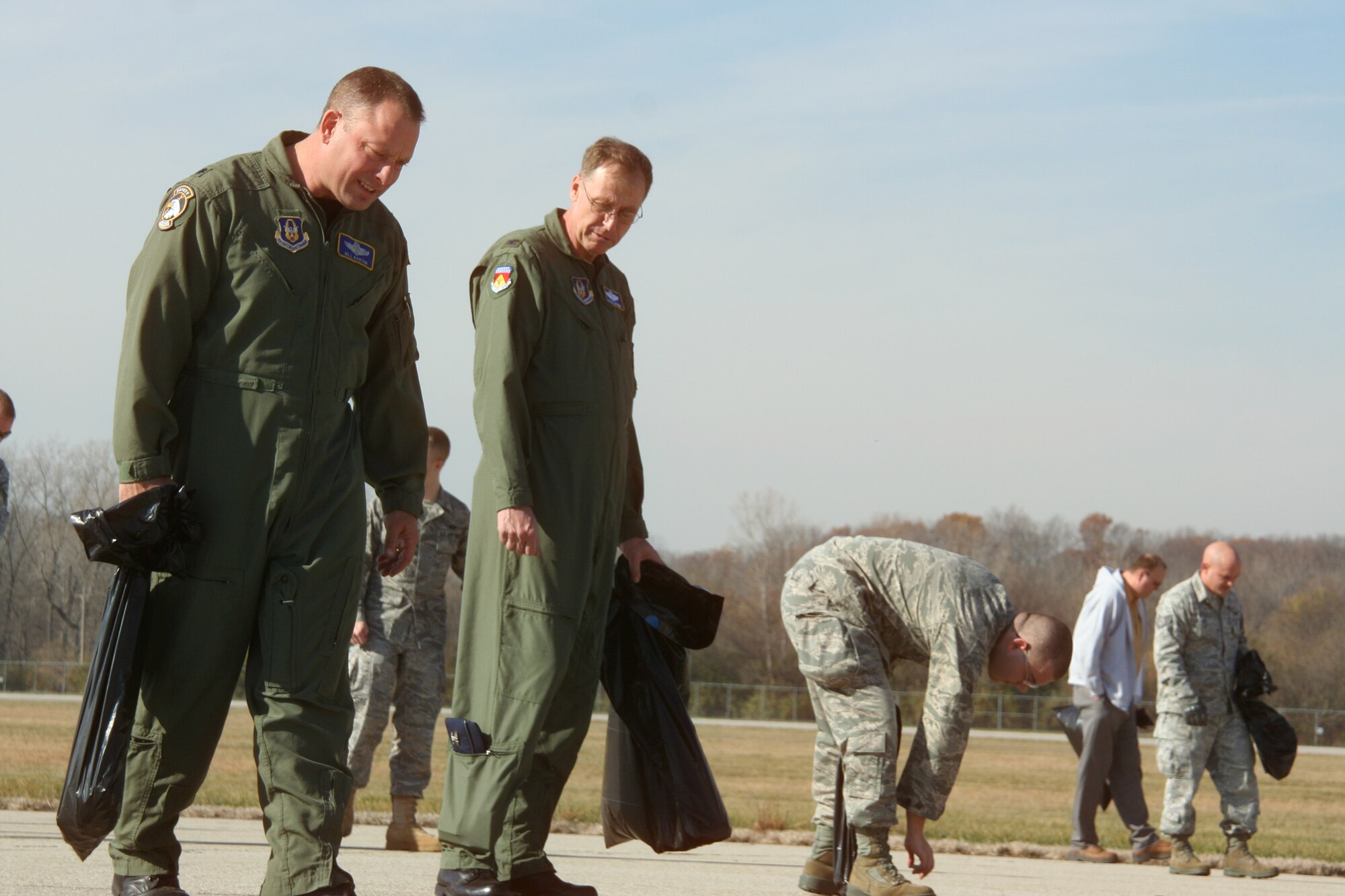 WRIGHT-PATTERSON AIR FORCE BASE, Ohio - Col. Stephen Goeman, 445th Airlift Wing, commander, and Lt. Col. Bill Barton, 445th AW safety office, walk the middle portion of the base’s main runway in search of debris during the base-wide FOD walk Nov. 10.  More than 40 men and women from the wing joined 150 others from across the base to participate in the FOD walk, finding more than 440 pounds of debris on the base’s main 12,000 foot runway. (U.S. Air Force photo/Capt. Rodney McNany)