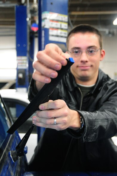ELLSWORTH AIR FORCE BASE, S.D. - Airman 1st Class Eli Goff, 28th Operations Group air traffic controller, checks his wiper blades for safety during the winter season, Nov. 17.  Wiper blades should be checked often during the winter, so make sure the cold weather has not cracked the blades. (U.S. Air Force photo/Senior Airman Anthony Sanchelli)
