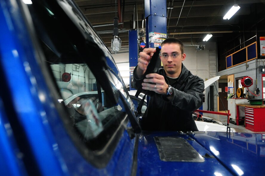 ELLSWORTH AIR FORCE BASE, S.D. - Airman 1st Class Eli Goff, 28th Operations Group air traffic controller, checks his wiper blades for safety during the winter season, Nov. 17.  Wiper blades should be checked often during the winter, so make sure the cold weather has not cracked the blades. (U.S. Air Force photo/Senior Airman Anthony Sanchelli)
