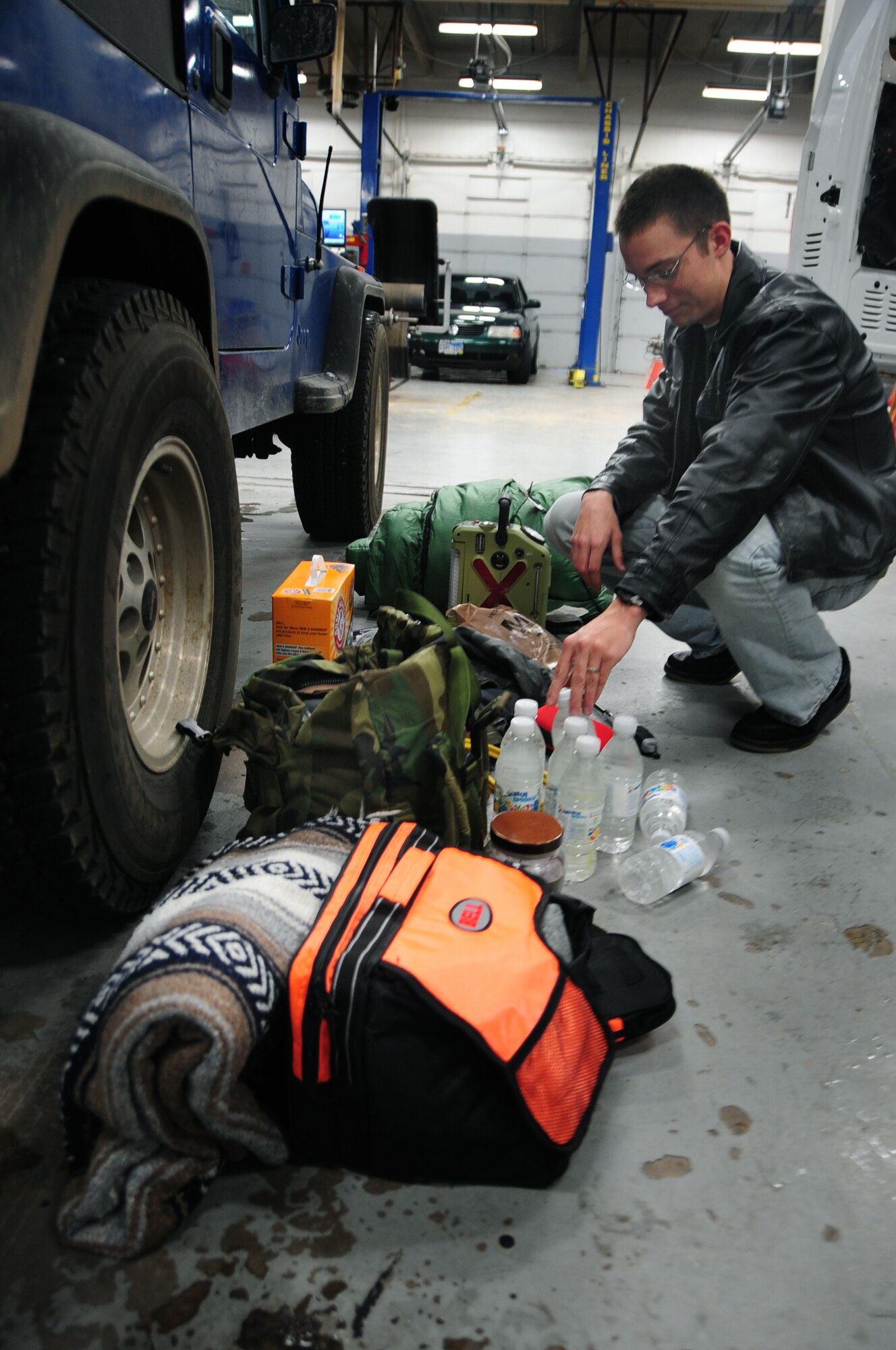 ELLSWORTH AIR FORCE BASE, S.D. - Airman 1st Class Eli Goff, 28th Operations Group air traffic controller, prepares items to put in his vehicle for safety during the winter season, Nov. 17.  With the holiday season fast approaching, Airmen are encouraged to keep emergency items in their vehicles such as first-aid kits and extra blankets. (U.S. Air Force photo/Senior Airman Anthony Sanchelli)
