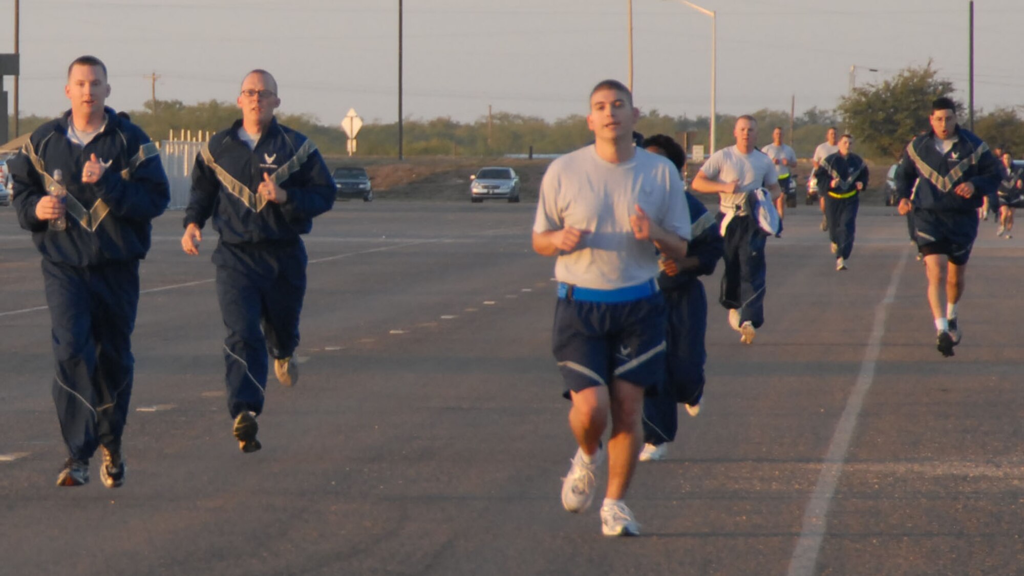 GOODFELLOW AIR FORCE BASE, Texas-- Airman tackle the last stretch of the annual Turkey Trot Fun Run/Walk at the triangle here Nov. 10. Airman 1st Class Duayne Martinez, 17th Contracting Squadron took first place, finishing the two-mile run in just over 15 minutes. (U.S. Air Force photo/Airman 1st Class Jessica D. Keith) 