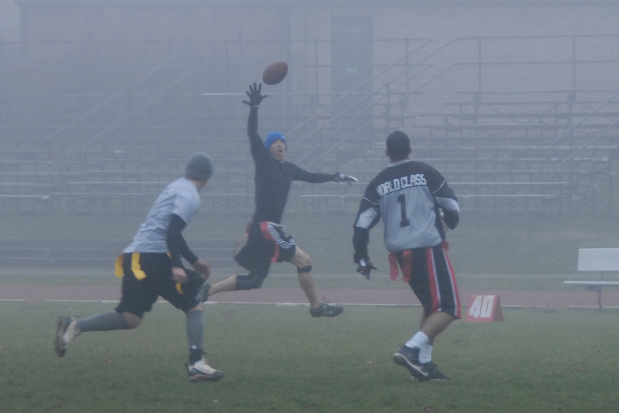 ROYAL AIR FORCE LAKENHEATH, England – Staff Sgt. Robert Chafin, 48th Logistics Readiness Squadron fixed facilities supervisor, catches the ball during the squadron’s first Turkey Bowl flag football game Nov. 19. The NCO team won the game 64 to 30 over the Airmen and officers, giving them bragging rights and the ability to eat first at the squadron’s Thanksgiving luncheon. (U.S. Air Force photo/Airman 1st Class Erin Zabarnick)